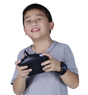 Young Boy Playing witha Battery-Operated Video Game Controller