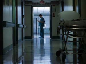 A medical professional standing in the hospital hall
